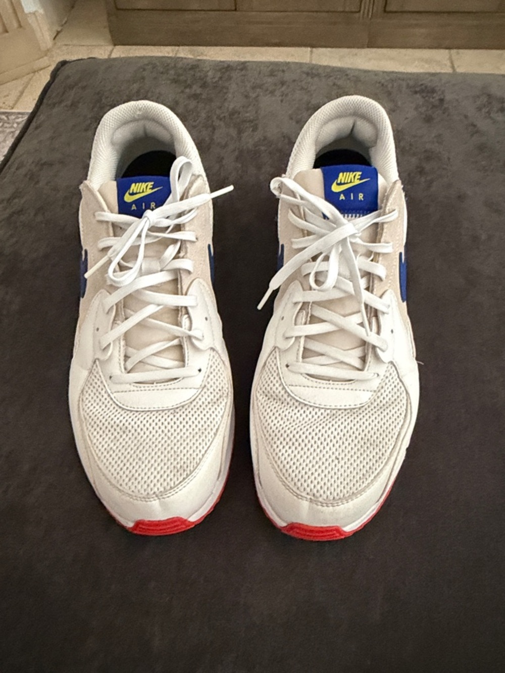 Nike Men's White Sneakers with Blue and Red Accents